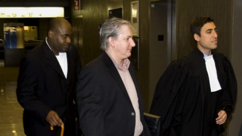 F�licien Souka, � gauche, et Jean Cholette, au centre, deux des coaccus�s dans l'affaire Norbourg (archives)