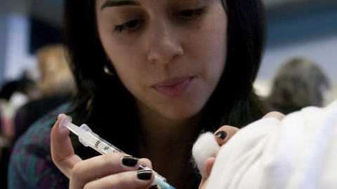 � l'heure de la vaccination