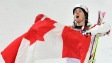 Le Qu�b�cois Alexandre Bilodeau remporte la toute premi�re m�daille d'or canadienne de l'histoire olympique en ses terres.