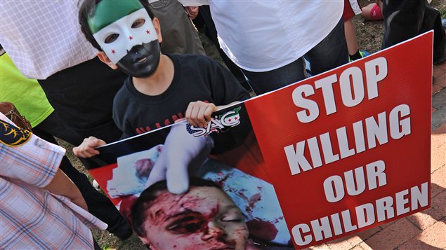 Un enfant dénonce la situation en Syrie lors d'une manifestation à Washington, en mars 2012