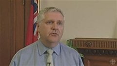 Le ministre Gord Mackintosh. Son fils est accusé de vol à main armée.