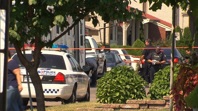 There were bullets all over a car and the garage of a Laval home, but nobody heard any gunshots in Sunday morning's slaying.