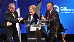La chef du PQ Pauline Marois est escort�e par ses gardes du corps lors de son dicours, le 4 septembre.