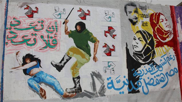 Murale, près de la place Tahrir, au centre du Caire, illustrant les agressions contre les femmes