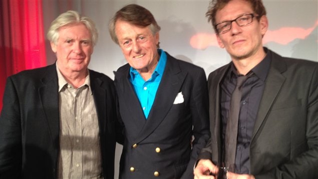 2012 Griffin Poetry Prize winners, David Harsent left, and Ken Babstock right, flank Scott Griffin who established one of the world's most generous prizes for Canadian and international poetry