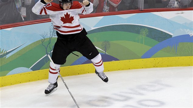 In this Feb. 28, 2010, file photo, Canada's Sidney Crosby leaps in the air in celebration after scoring the game-winning goal in overtime of the men's gold medal ice hockey game against the United States at the Vancouver 2010 Olympics. Crosby is among those unhappy with Russia's anti-gay law. Crosby is seen in his white jersey with the red maple leaf on the chest.