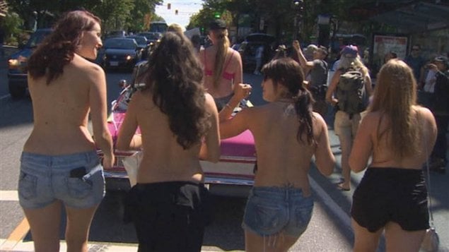 Dozens of women bared the breasts on Sunday in Vancouver as partof "international go-topless day".