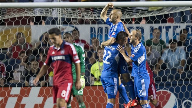 Los jugadores del Impact, de Montreal, celebran un gol del delantero italiano Di Vaio.