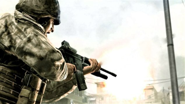 A virtual soldier in battle dress follows his rifle into action.