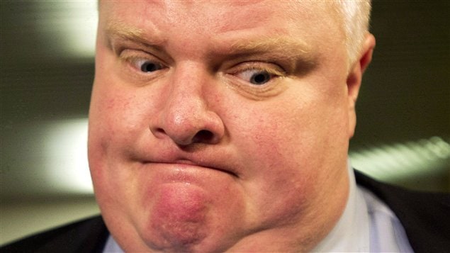 Toronto Mayor Rob Ford, Canada's Newsmaker of the Year, addresses the media outside office in Toronto in November. His face is scrunched up, his mouth tense and closed down, his eyes searching below him for answers.