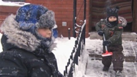 Two kids shovels in hand hit their house path to make things right. Between 25 and 35 centimetres of snow fell in Montreal this past weekend.