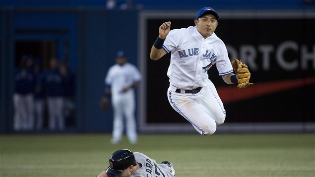 Utility player Munenori Kawasaki, shown high in the air over second base on a double play relay was one of the few bright spots in a miserable 2013 season for the Toronto Blue Jays. 