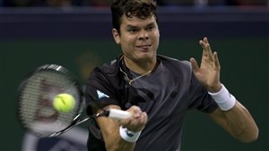 Milos Raonic, in a grey shirt and tongue jutting between his lips, hits a forehand at the Shanghai Masters in October. Raonic won the Lionel Conacher Award as the Canadian Press male athlete of the year with 45 per cent of the vote. Jon Cornish finished second with 22 per cent. Raonic in a grey shirt is show hitting a forehand.
