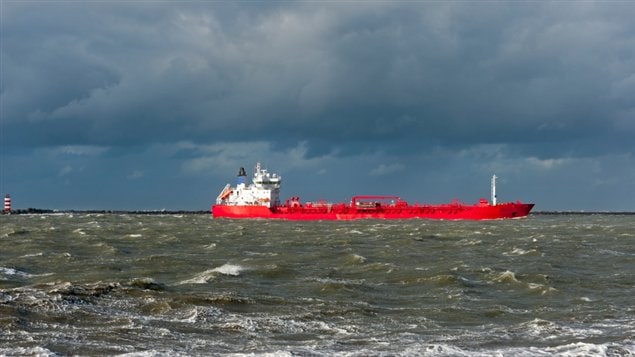 A red oil tanker  sailing on choppy green waters in the Beaufort Sea. (iStock)
