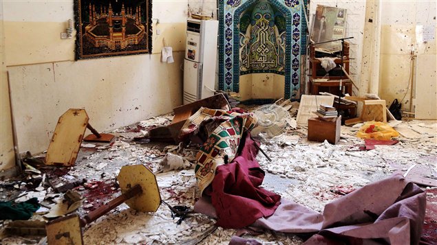 آثار الدمّار الناجمة عن هجوم وقع في جنوب بغداد في 27 أياار مايو 2014