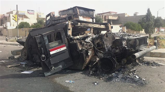 حطام آلية عسكرية في الموصل