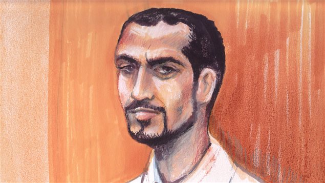 Omar Khadr as he appeared in an Edmonton courtroom 2013 in this artist's sketch.  Khadr has made a request to speak with the Canadian media. Khadr has close cropped black hair that is beginning to recede. He has a slim beard, mustache and goatee. He has a Roman nose and prominent eyebrows. He has a serious look on his face and is wearing a white shirt.