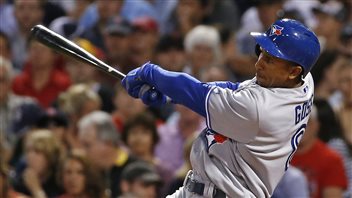 Anthony Gose hits a 2-RBI double during the fourth inning of a baseball game against the Boston at Fenway Park on Tuesday. Gose has played a big role of the Jays' current hot streak. Gose, a lefty hitter, is completing his swing with his hands extended and his dark bat out to his right. 