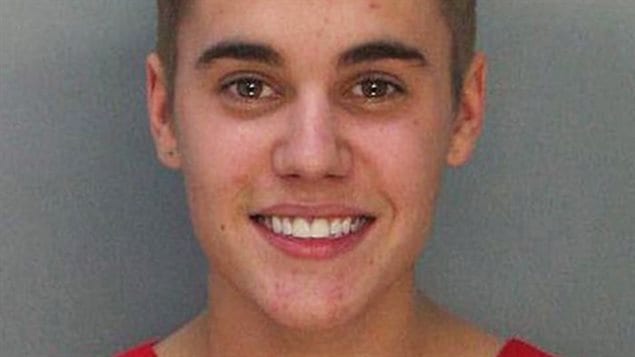 Justin Bieber smiling for his mug shot at the Miami Dade County Corrections Department on Jan. 24, after he was arrested for alleged street racing.