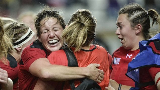Canadian players rejoice after defeating France 18-16 in the IRB Women's Rugby World Cup semifinal at the Jean Bouin Stadium in Paris on Wednesday