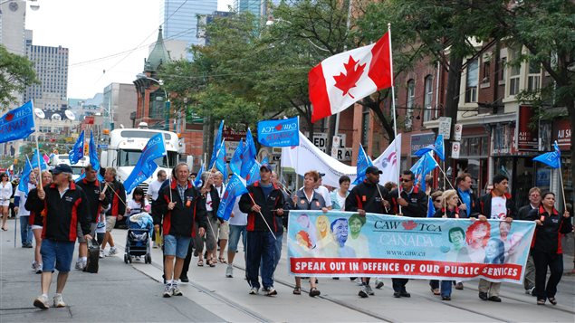 File photo of Toronto's 2011 Labour Day Parade. It's one of the largest of the many under way across the country today.