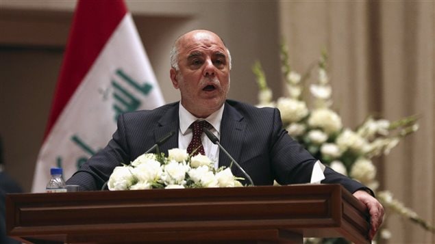 رئيس الوزراء العراقي الجديد حيدر العبادي متوجهاً أمس إلى أعضاء البرلمان في بغداد قبل إعلانه تشكيلته الحكومية