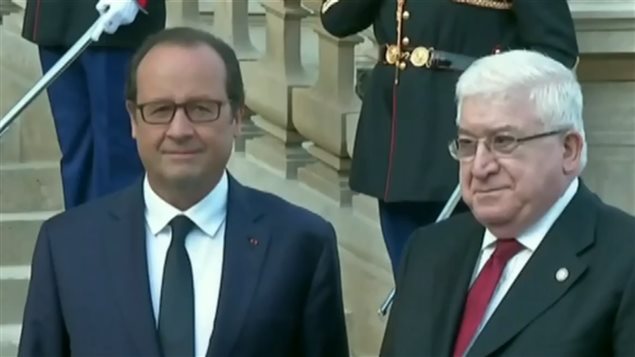 El presidente francés François Hollande y el presidente irakí Fuad Mossum
