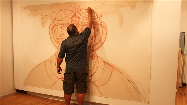 Iran Planta pintando en vivo el mural en la Artothèque de Montreal.