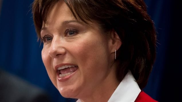 B.C. Premier Christy Clark defends against accusations she promised jobs as Temporary Foreign Workers to people in India during a recent trade mission
