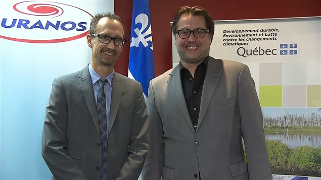 Alain Bourque, Director general de Ouranos (izq) y David Heurtel, ministro de Medioambiente de Quebec.