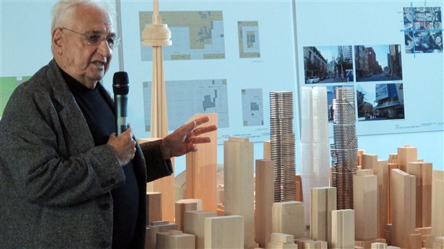 Frank Ghery, the legendary Toronto-born architect beside the model of his down-town Toronto development announced in the fall of 2012.  The 3 towers of the Mirvish-Gehry development have now been reduced to two towers; one 82-storey, and another 92-storey building.