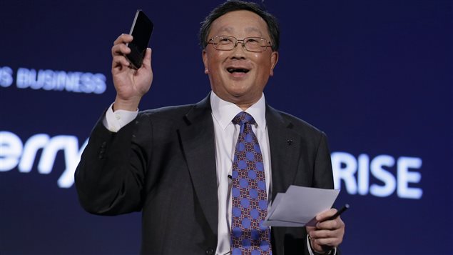 BlackBerry CEO John Chen holds up a Classic phone, during the BlackBerry Enterprise Portfolio Launch in San Francisco in November. BlackBerry is expanding its efforts to sell mobile-security software on its rivals' smartphones and tablets to help counter the waning popularity of its own devices.  The Classic was released December 17th, 2014.