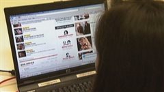 Reader beware: all you read my not be true. Photo shows a female reader in front of an open computer screen.