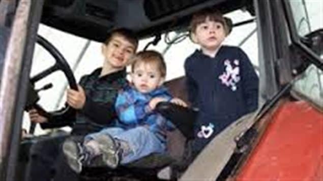 The Gagnon children in an undated photo.We Mathis at the driver's wheel of a truck in the left of the photo.In the middle is two-year-old Felix. On the right is four-year-old Lorie. Mathis has a smile on his face. Felix and Lorie wear serious expressions.