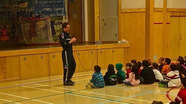 Collin Goyman, a paramedic based in Cambridge Bay, announces the attendance incentive to students. 