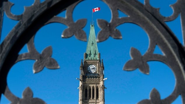 In Ottawa, the Centre Block's Peace Tower is shown through the gates of Parliament Hill where the three main political parties are unofficially campaigning in this election year.