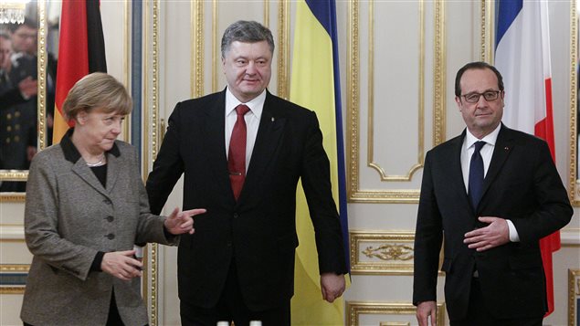 La canciller alemana Angela Merkel, el presidente ucraniano Petro Porochenko y el presidente francés François Hollande