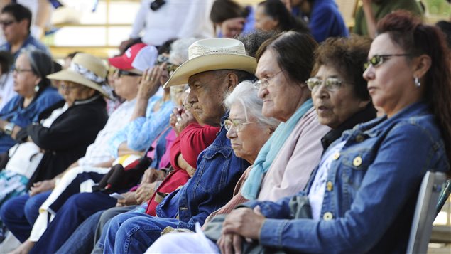 Natives from the Blood Indian Reserve watch Canadian Prime Minister Stephen Harper at a Kainai Chieftainship ceremony in Stand Off, Alberta, in July 2011