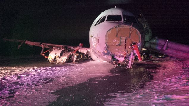 No one was critically injured when this Air Canada jet skidded off a runway as it landed early Sunday in a snowstorm in Halifax after losing its nose and landing gear. We look directly at the sheared off nose of the plane. It's right wing and engine are in shambles. The plane, looking like a wounded beast, sits amid snow and ice.