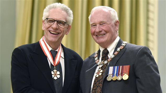 Governor General David Johnston (right) invests David Cronenberg, as a Companion of the Order of Canada during an investiture ceremony at Rideau Hall today in Ottawa.