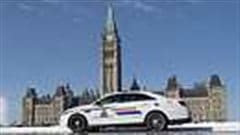 An RCMP police car sits outside the Parliament buildings on Parliament Hill in Ottawa, February 6, 2015. The Government has created an RCMP unit to take over all security on Parliament Hill.