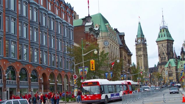 September 2006. This is Elgin Street in the area known as "Centretown" in downtown Ottawa, Ontario, looking towards the Parliament Buildings from Queen Street. The Victory and Peace Tower of Parliament can be seen in the background
