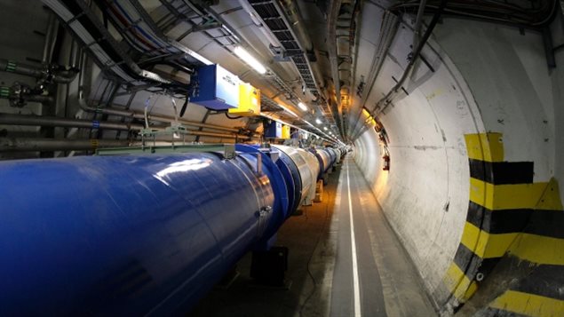 The LHC (large hadron collider) in its tunnel at CERN (European particle physics laboratory) near Geneva, Switzerland in a 2007 file photo. Scientists say they set a new energy record ahead of the massive machine's full restart in June