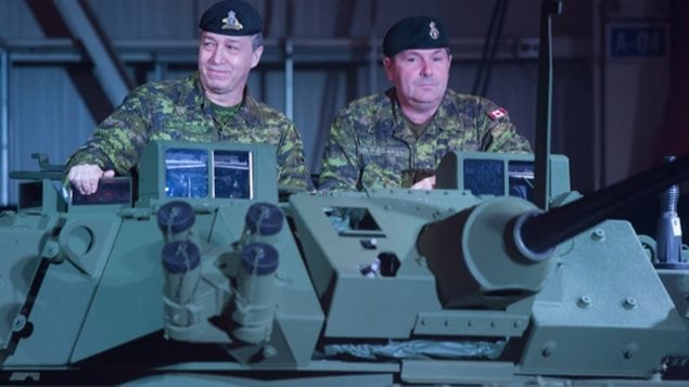 Canadian soldiers show an upgraded light armoured vehicle at a news conference on Jan. 24, 2012. General Dynamics won a multi-billion dollar contract to provide such vehicles to Saudi Arabia.