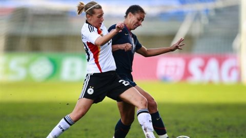 Germany's Lena Goebling (left) and Shanon Boxx of the U.S. vie for the ball. Goebling told Germany's Bild newspaper that the German team has found gender testing amusing. But for some players, just the idea of it is humiliating