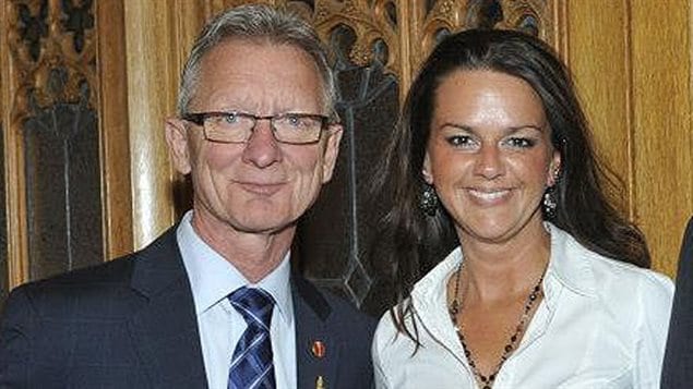 In this 2014 photo Quebec Conservative Senator Pierre-Hugues Boisvenu is pictured with staff employee Isabell Lapointe. He was ordered to apologize to Senate colleagues for renewing her contract while they were dating. He announced last week that he was 