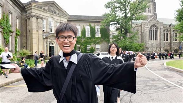 Anh Cao celebrating after the graduation ceremony from the Univerity of Toronto