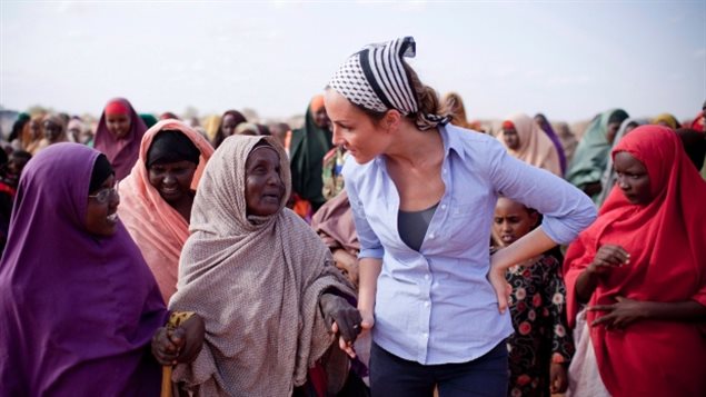 Amanda Lindhout, above working in Somalia during her 2011 return to the country, was kidnapped in 2008 near Mogadishu and held hostage for 15 months, along with Austrailan photographer, Nigel Brennan. RCMP arrested one of her alleged kidnappers in Ottawa last Thursday.