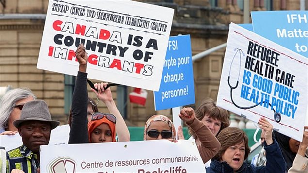 Demonstrators on Parliament Hill in June 2012 called on the government to reverse cuts to refugee health care. Such protests have become an annual event.