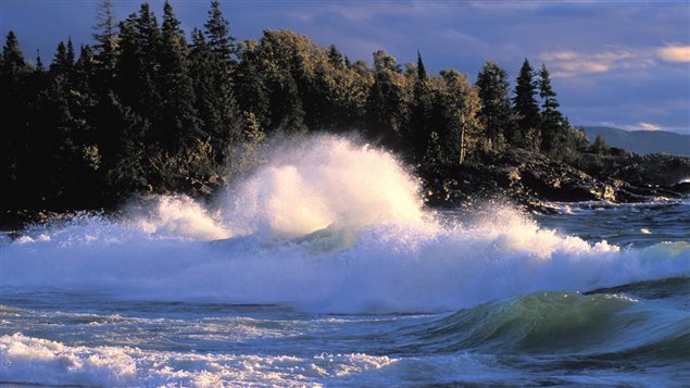 Waves crash on shore during at Lake Superior's Government Beach near Wawa, Ont. Environmentalists worry about the future of the five Great Lakes because too little is being done to stop chemical pollution. We see waves crashing high into the air along a beach surrounded by lovely, dark pines.